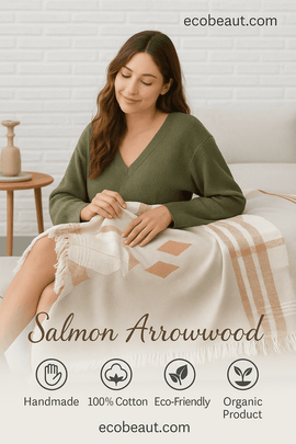 Eco-friendly Salmon Arrowwood 100% cotton blanket styled in a cozy bedroom, organic and handmade product