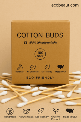 Eco-friendly cotton buds in kraft paper packaging with scattered sticks around – 100% biodegradable and made in USA, available on ecobeaut.com