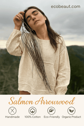 Eco-friendly handmade 100% cotton sweatshirt by Salmon Arrowwood, modeled outdoors with natural dried branches – breathable and organic, available at ecobeaut.com.