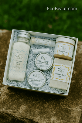 EcoBeaut.com natural skincare gift set with bath salts, herbal salves, vapor rub, and oatmeal honey soap in white box on natural stone background