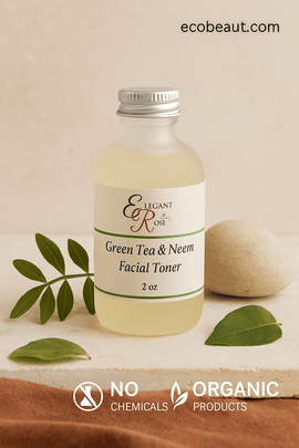 Elegant Rose Green Tea & Neem Facial Toner bottle on natural beige surface with green leaves and stone, ecobeaut.com in top right corner, icons for no chemicals and organic products below