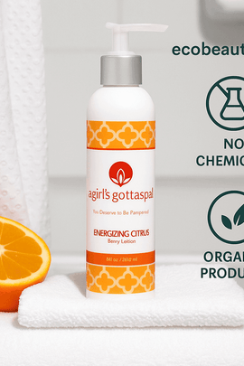 Energizing Citrus Body Lotion by A Girl’s Gotta Spa! placed in a spa-like bathroom scene with fresh orange and soft towel – organic ingredients, no chemicals, ecobeaut.com