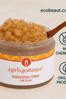 Energizing Citrus Salt Scrub in eco-friendly plastic jar with wooden spoon on marble surface – organic skincare product, no chemicals, ecobeaut.com