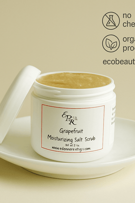 Grapefruit Moisturizing Salt Scrub in a white jar by Elegant Rose, displayed on a ceramic dish – organic exfoliating body scrub, no chemicals, ecobeaut.com