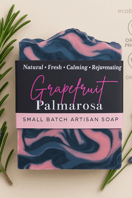 Grapefruit Palmarosa artisan soap bar with deep navy blue and pink swirls, surrounded by rosemary and lavender, featuring ecobeaut.com, “NO CHEMICALS,” and “ORGANIC PRODUCTS” icons in the top right corner.



