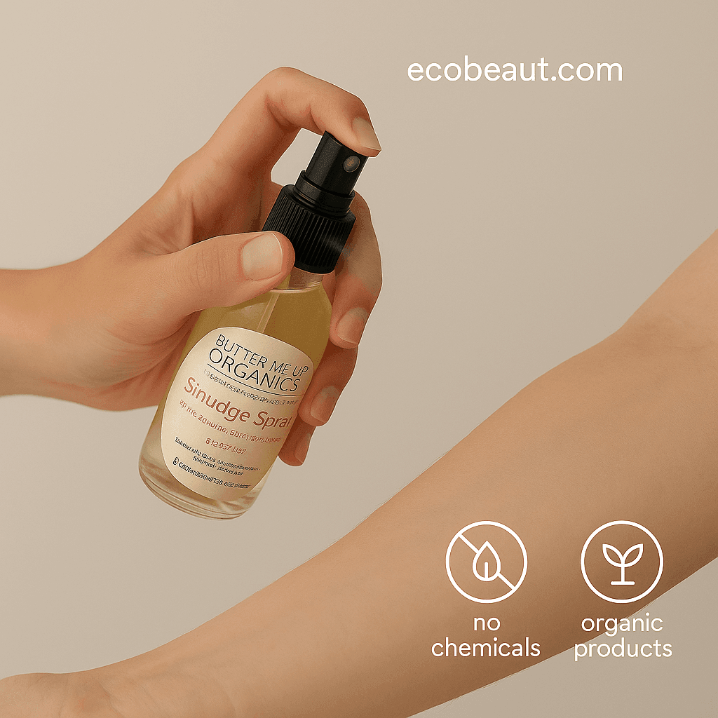 Hand spraying Butter Me Up Organics Smudge Spray onto a forearm with a soft beige background, featuring “no chemicals,” “organic products” icons and ecobeaut.com in the top right corner.