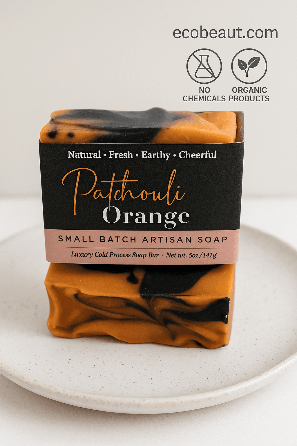 Handcrafted Patchouli Orange artisan soap by ecobeaut.com on a ceramic plate, featuring “NO CHEMICALS” and “ORGANIC PRODUCTS” icons in the top right corner.