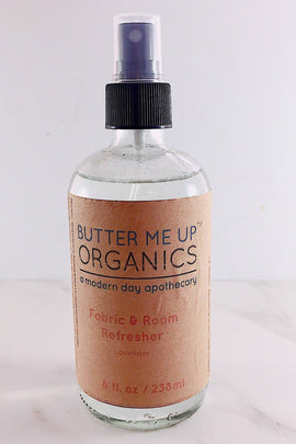 Butter Me Up Organics fabric and room refresher bottle on a white background