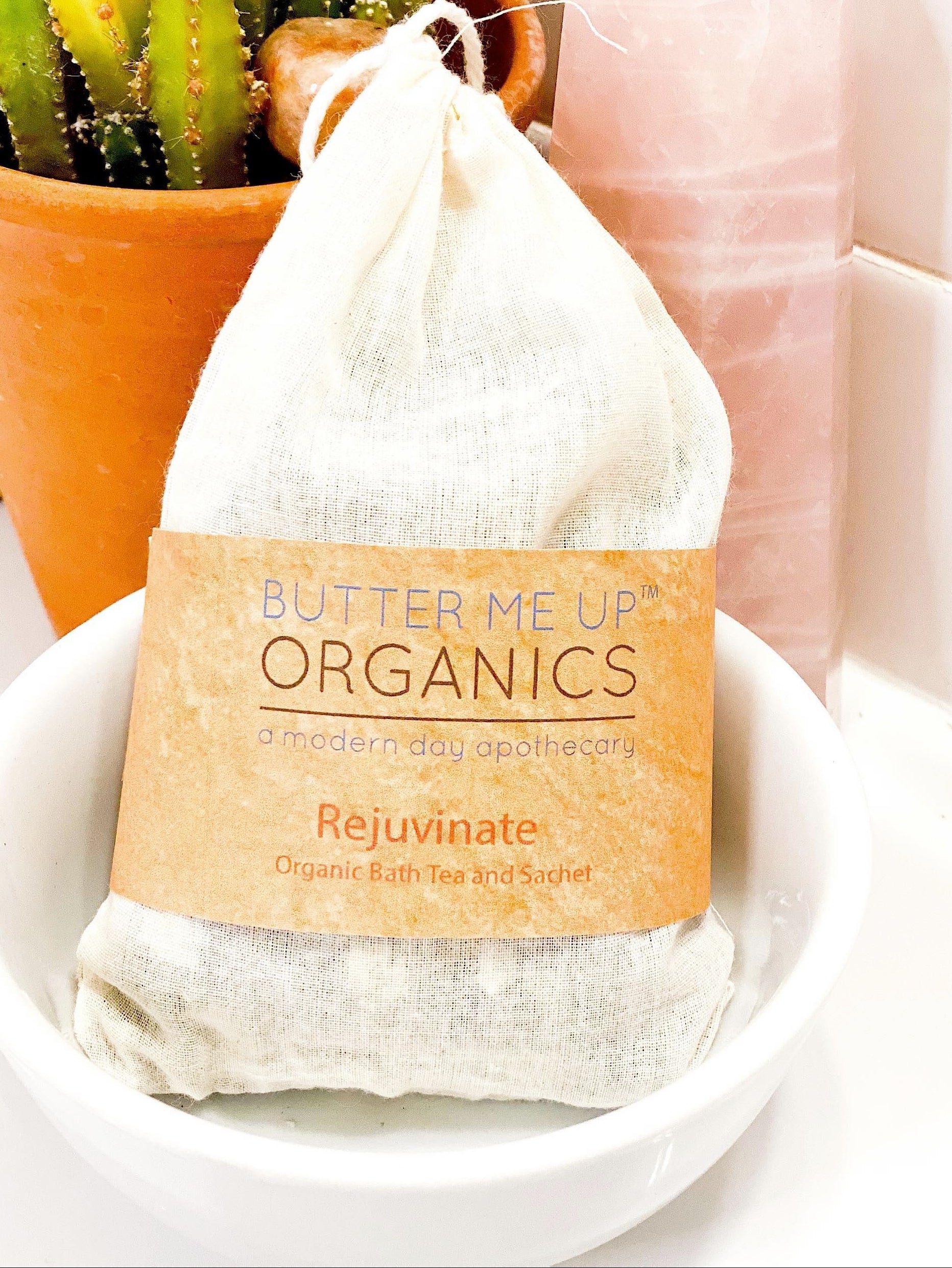 Butter Me Up Organics bath tea package with a cactus plant in the background