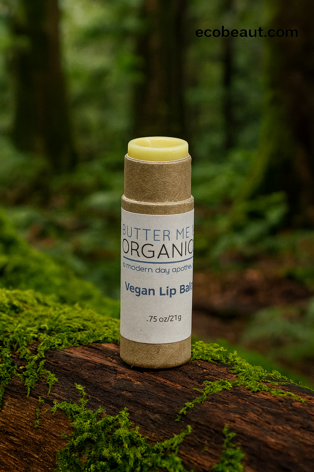 Butter Me Organic vegan lip balm on a wooden log with a forest background