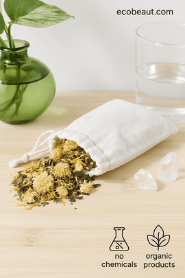 Organic bath tea blend for psoriasis and eczema relief in a cotton drawstring bag on dark wood background – ecobeaut.com