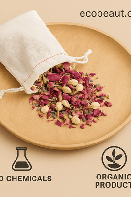 Organic herbal bath tea in muslin pouch with rose petals, jasmine, and lavender spilling onto wooden plate – labeled no chemicals and organic product, ecobeaut.com