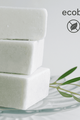 Peppermint Eucalyptus Shampoo Bars stacked on a glass plate with green leaves, labeled ecobeaut.com, No Chemicals, Organic Products.








