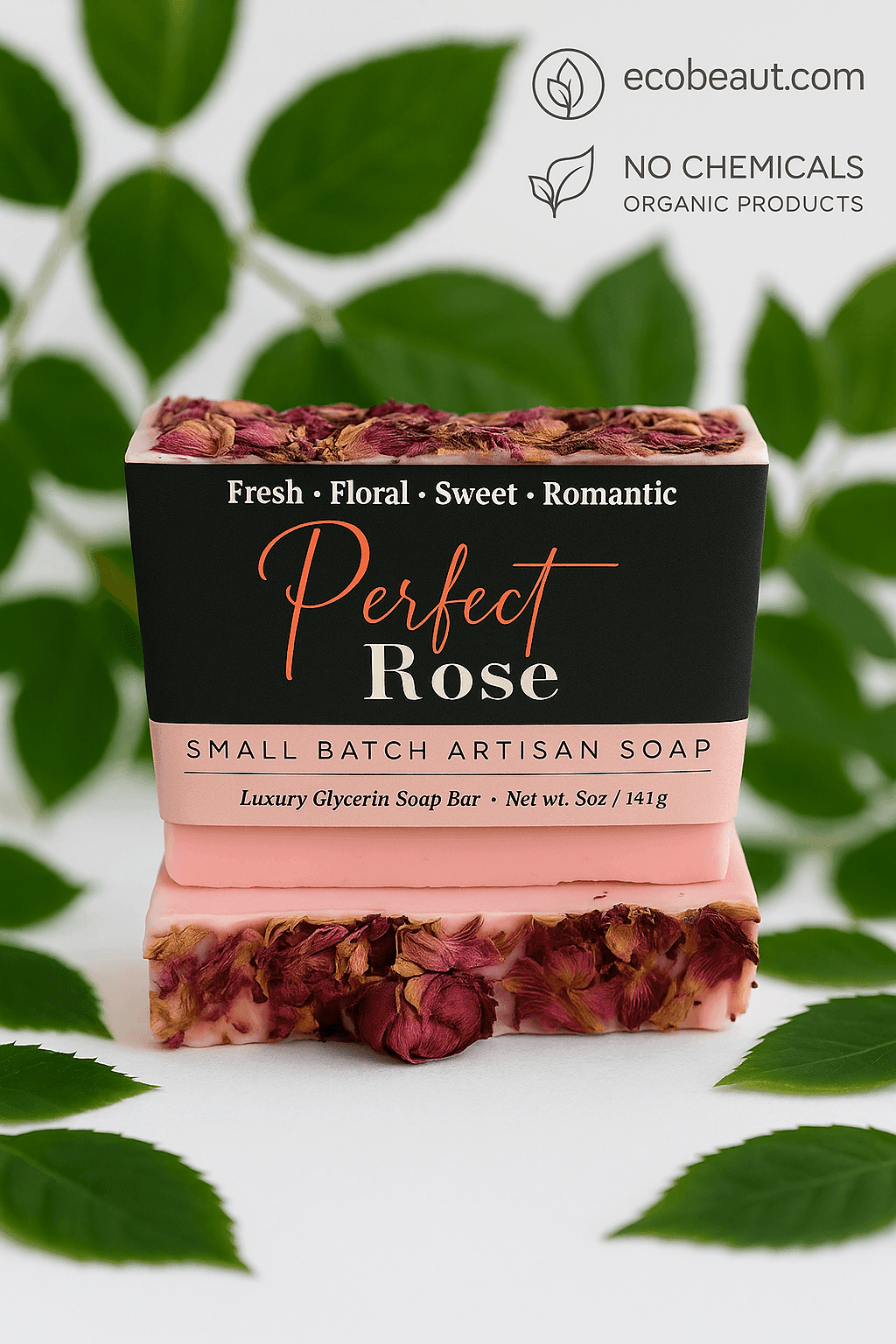 Perfect Rose artisan soap bar by ecobeaut.com surrounded by fresh green leaves, with “NO CHEMICALS” and “ORGANIC PRODUCTS” icons in the top right corner.