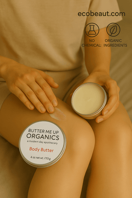 Person holding a container of Butter Me Up Organics body butter with visible branding and product details.