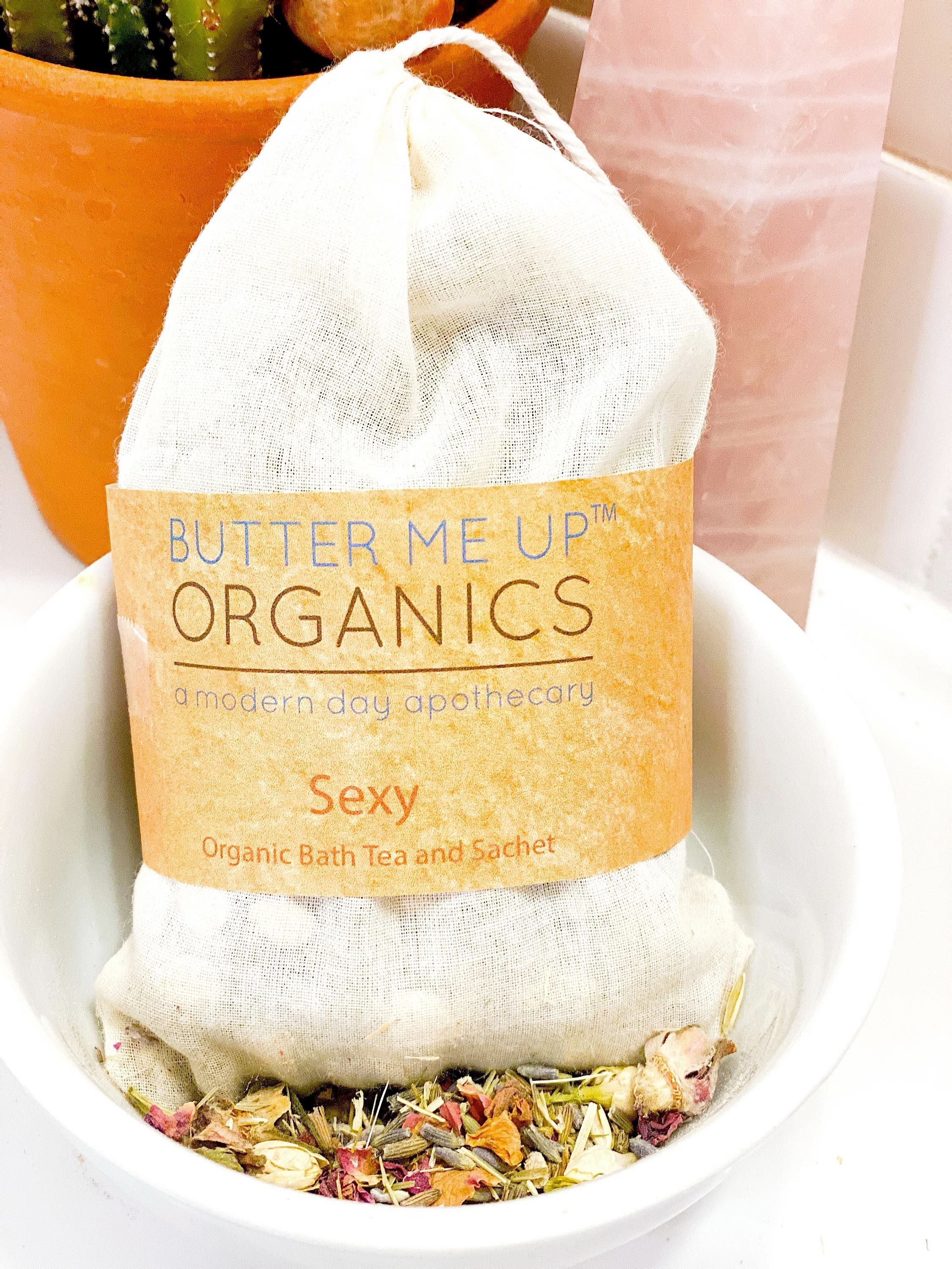 Butter Me Up Organics bath tea and soap in a white bowl with a cactus in the background
