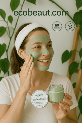 Smiling woman applying organic Sea Mud Mask to her face, with ecobeaut.com and labels 'no chemicals, organic products' in the top-right corner – natural skincare in a serene indoor setting