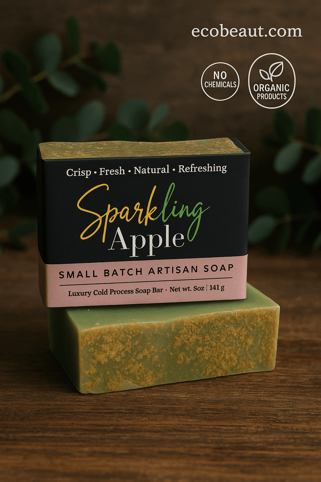 Sparkling Apple small batch artisan soap bar by ecobeaut.com on a wooden surface with green leaves in the background and labels “NO CHEMICALS” and “ORGANIC PRODUCTS” in the upper right corner.



