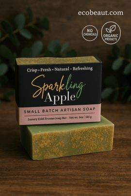 Sparkling Apple small batch artisan soap bar by ecobeaut.com on a wooden surface with green leaves in the background and labels “NO CHEMICALS” and “ORGANIC PRODUCTS” in the upper right corner.



