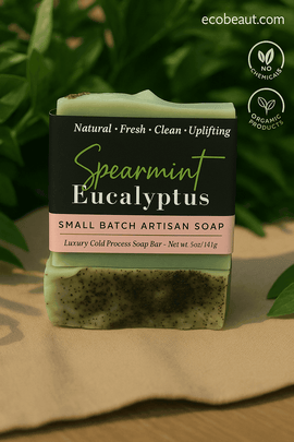 Spearmint Eucalyptus soap bar by ecobeaut.com displayed on beige linen with green leaves in the background, featuring “NO CHEMICALS” and “ORGANIC PRODUCTS” icons in the upper right corner.




