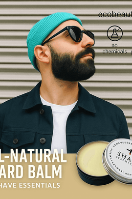 Stylish bearded man in teal beanie and sunglasses promoting All-Natural Beard Balm by Shave Essentials, with product tin displayed and branding elements like ecobeaut.com, no chemicals, and organic products icons.
