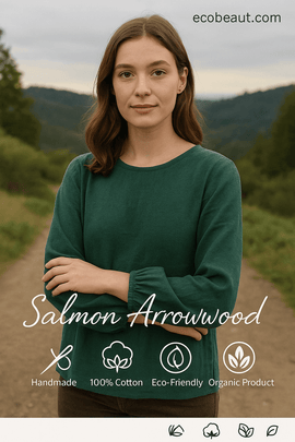 Sustainable green 100% cotton blouse by Salmon Arrowwood worn by a young woman in nature – eco-conscious fashion, handmade and organic, ecobeaut.com