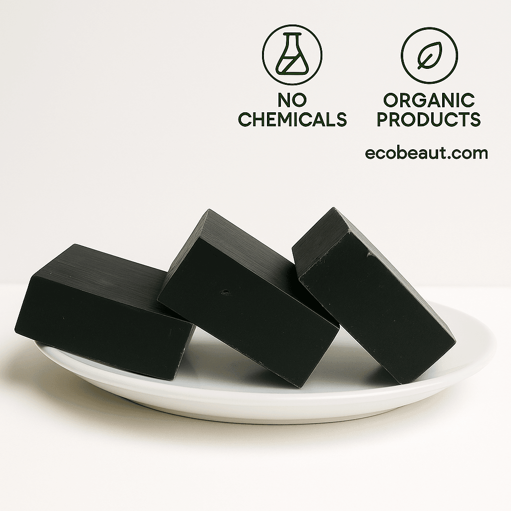 Three black soap bars by ecobeaut.com arranged on a white plate with “NO CHEMICALS” and “ORGANIC PRODUCTS” icons and the website ecobeaut.com displayed in the upper right corner.