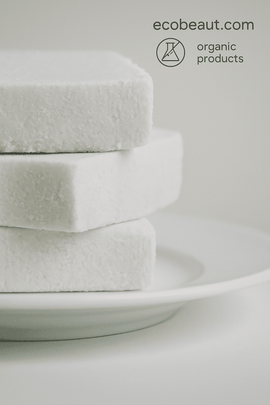 Three handmade organic soap bars with natural texture stacked on a white ceramic plate – eco-friendly skincare, ecobeaut.com, no chemicals, organic products