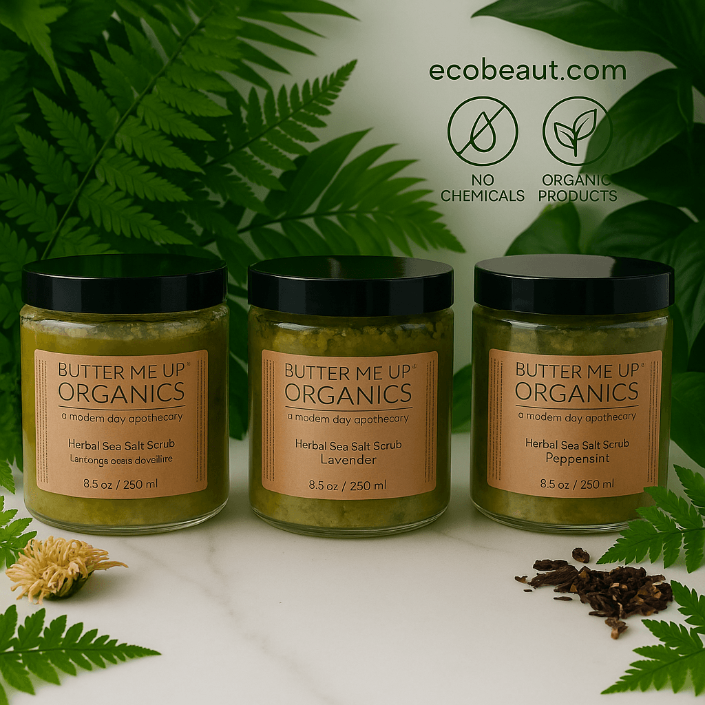 "Three jars of herbal sea salt scrub with eco labels and ecobeaut.com branding, surrounded by lush green leaves on a white marble surface."




