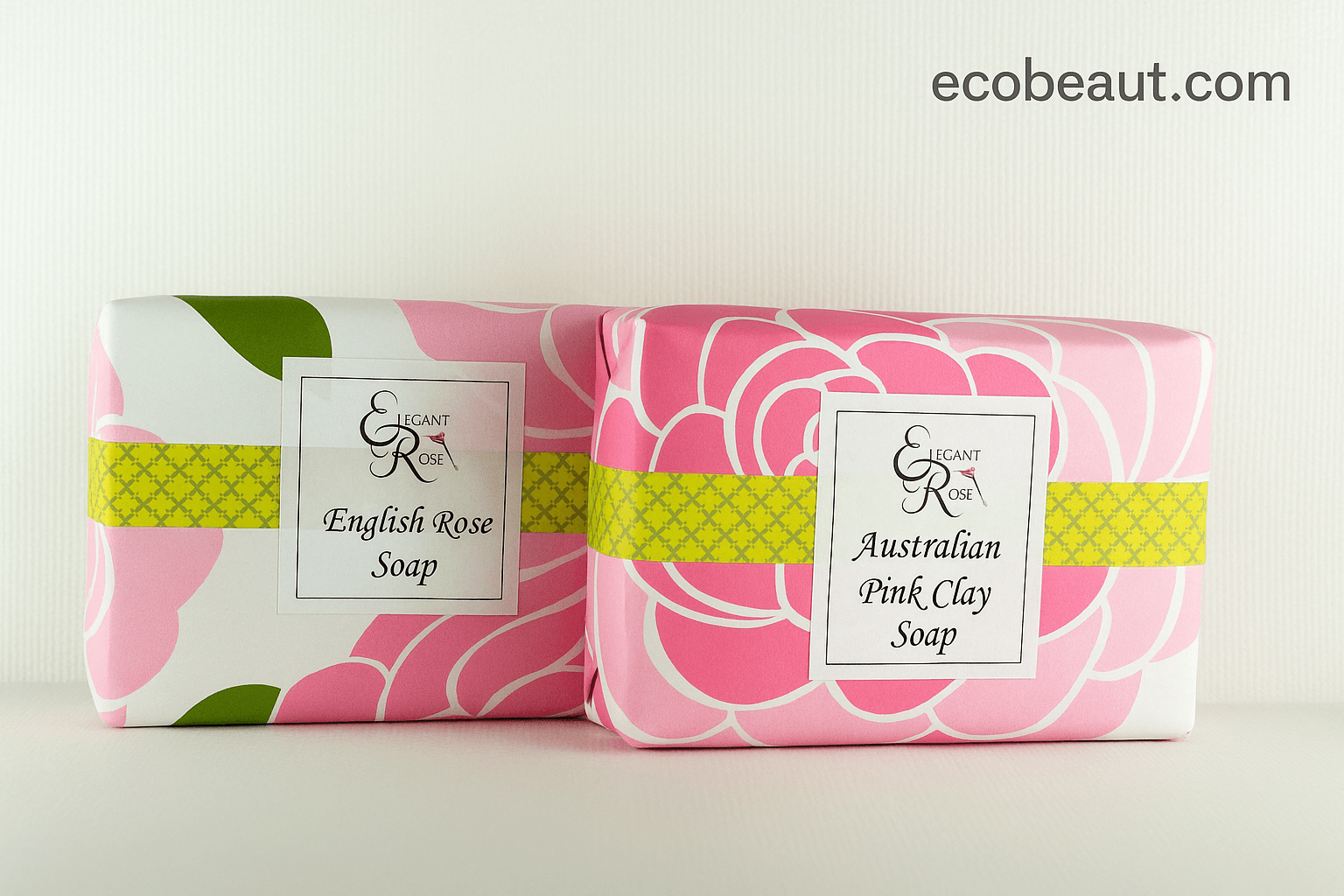 Two Elegant Rose soaps—English Rose and Australian Pink Clay—wrapped in floral packaging with yellow accent bands, displayed on a light background with ecobeaut.com in the top right corner.