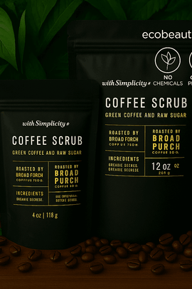 "Two coffee scrub pouches on wood with coffee beans, lush leaves, eco labels, and ecobeaut.com branding in the top right corner."