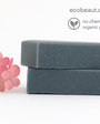 Two stacked charcoal soap bars with pink flowers – detoxifying handmade soap with no chemicals and organic ingredients, ecoBeaut.com