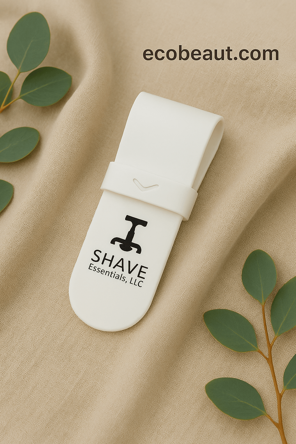 White silicone razor case by SHAVE Essentials on soft linen with eucalyptus leaves, branded ecobeaut.com
