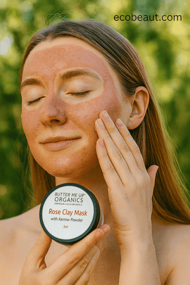 Woman applying Butter Me Up Organics Rose Clay Mask with Yarrow Powder outdoors, natural organic skincare treatment for glowing skin, EcoBeaut.com branding