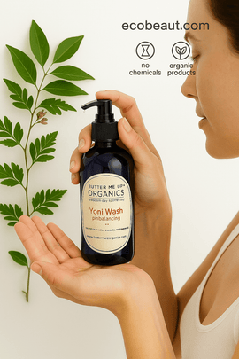Woman applying Yoni Wash by ecobeaut.com onto her hand, surrounded by green leaves, with “NO CHEMICALS” and “ORGANIC PRODUCTS” icons in the top right corner.




