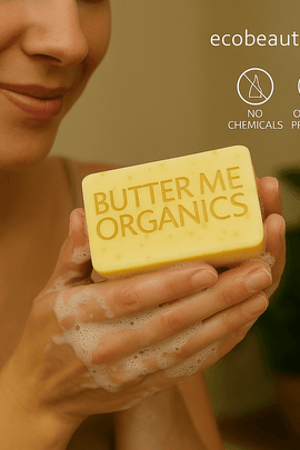 Woman gently washing hands with Butter Me Organics soap from ecobeaut.com, smiling softly, with “NO CHEMICALS” and “ORGANIC PRODUCTS” icons in the top right corner.





