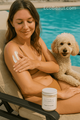 Woman applying Butter Me Up Organics vegan sunscreen on poolside lounge chair with golden poodle beside her, luxury poolside lifestyle, eco-friendly sun care, reef-safe vegan sunscreen made in USA, EcoBeaut.com