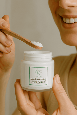Woman using organic remineralizing tooth powder – safe natural oral care from ecobeaut.com
