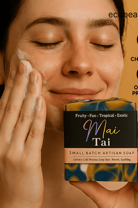 Woman washing her face with Mai Tai artisan soap from ecobeaut.com, smiling softly with “NO CHEMICALS” and “ORGANIC PRODUCTS” icons in the top right corner.