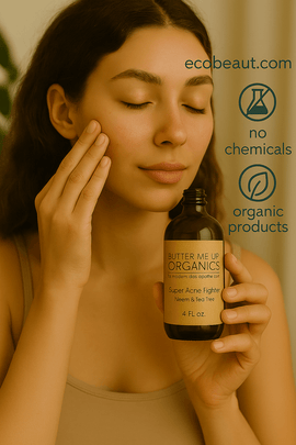Young woman applying Butter Me Up™ Organics Super Acne Fighter serum to her face, holding the amber bottle in a softly lit, neutral-toned setting, with ecobeaut.com and eco-friendly labels 'no chemicals' and 'organic products' in the top right corner