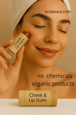 Young woman applying organic cheek and lip stain to her cheek, holding a kraft paper tube; beige background with “ecobeaut.com” in the top right and markings “no chemicals” and “organic products” at the bottom.