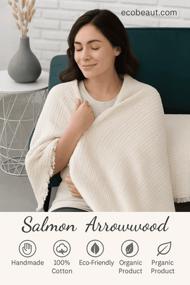 Young woman relaxing with a handmade organic cotton blanket from Salmon Arrowwood – soft, eco-friendly, and sustainable fabric