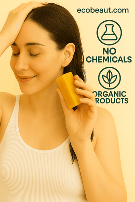 Young woman using a yellow organic shampoo bar on wet hair with a gentle smile, featuring eco-friendly 'no chemicals' and 'organic products' icons and ecobeaut.com text in the top right corner.