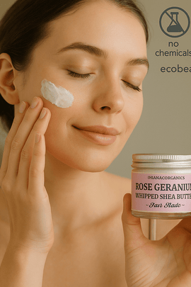 Young woman with fair skin applying Ohana Organics Rose Geranium Whipped Shea Butter to her cheek, smiling softly while holding the jar in one hand; eco-friendly icons and ecobeaut.com are displayed in the top right corner








