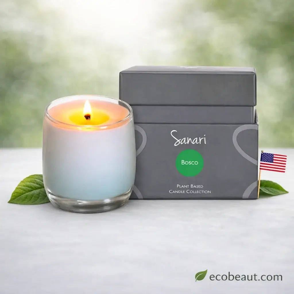 Sanari Bosco candle with a gray box and green leaf on a white surface