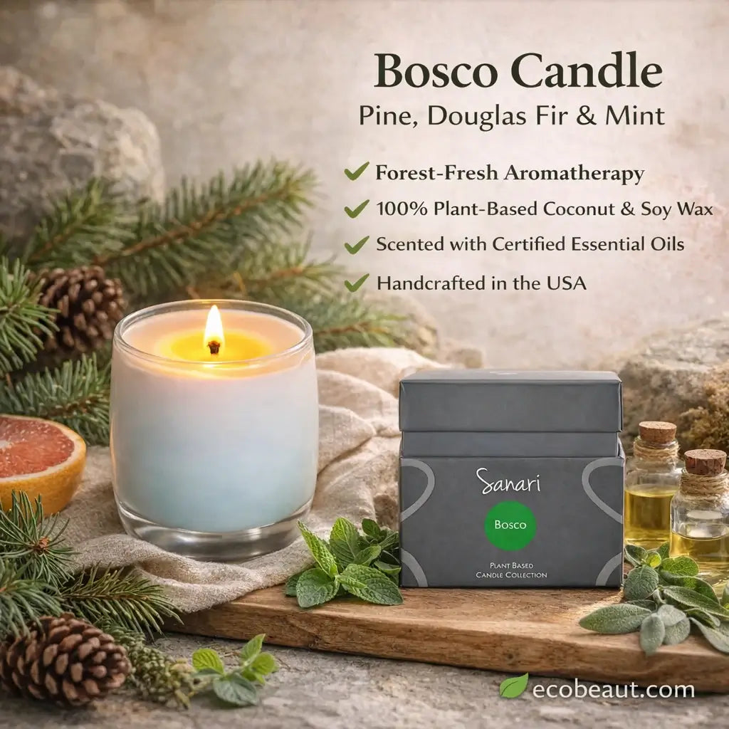 Bosco Candle with packaging on a wooden board with greenery and essential oils.
