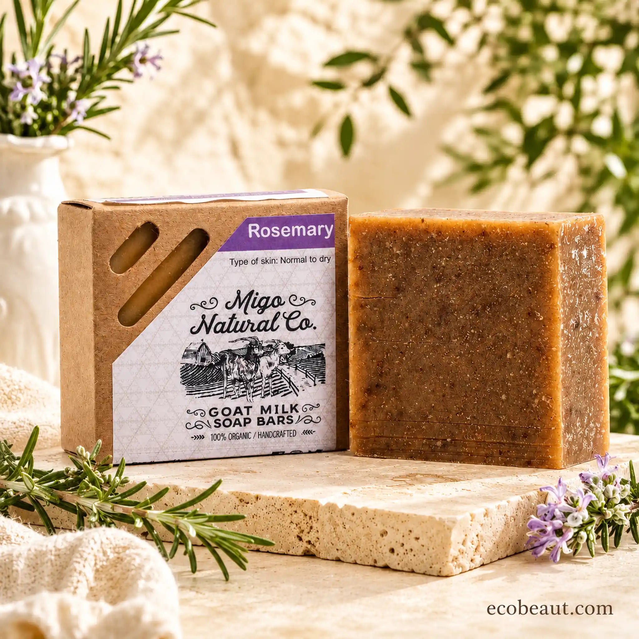 A bar of Migo Natural Co. Rosemary goat milk soap stands next to its kraft paper box packaging.