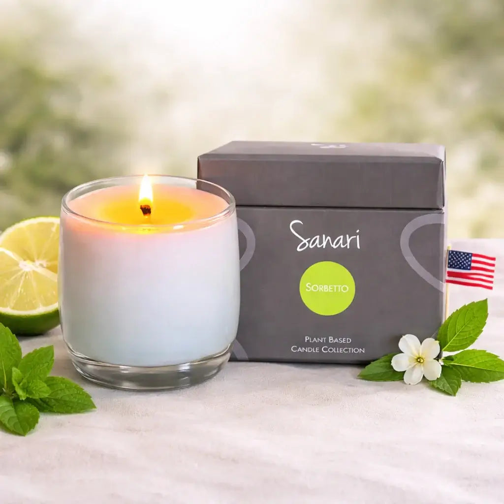 Sanari candle with packaging and decorative elements on a light surface