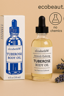 elizabethW Tuberose Body Oil with product box, lavender sprigs on the beige surface. Top right shows ecobeaut.com with icons: no chemicals, organic products.