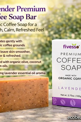 Lavender Premium Coffee Soap Bar with packaging on a wooden surface with blurred greenery in the background.